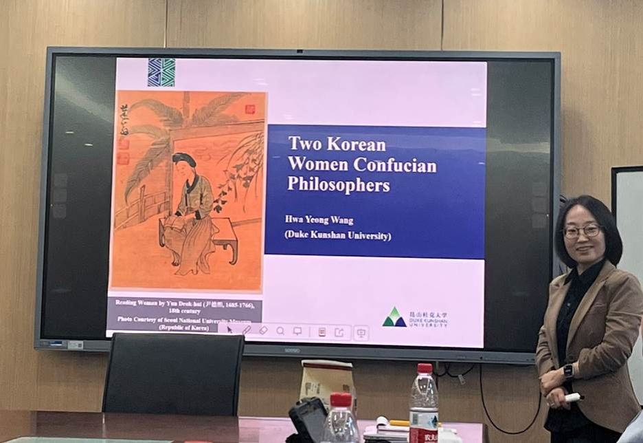 A person and person sitting at a table with a screenDescription automatically generated A person and person sitting at a table with a screenDescription automatically generated